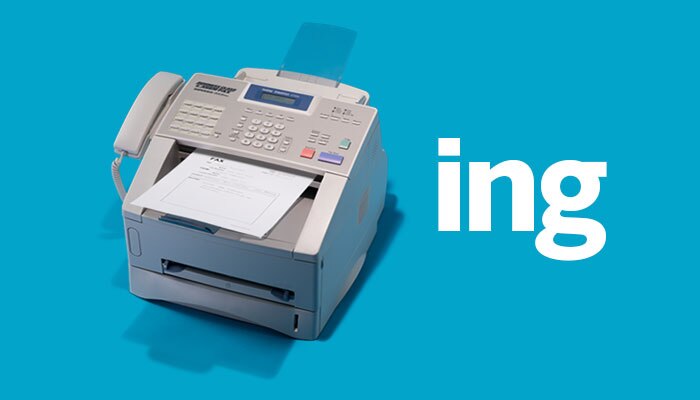 Fax machine next to the letters 